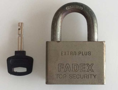 Image contains a photo of a small padlock with a key placed next to it.